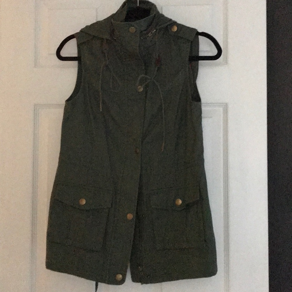 NWOT.  Vest with snaps, zipper and hood.